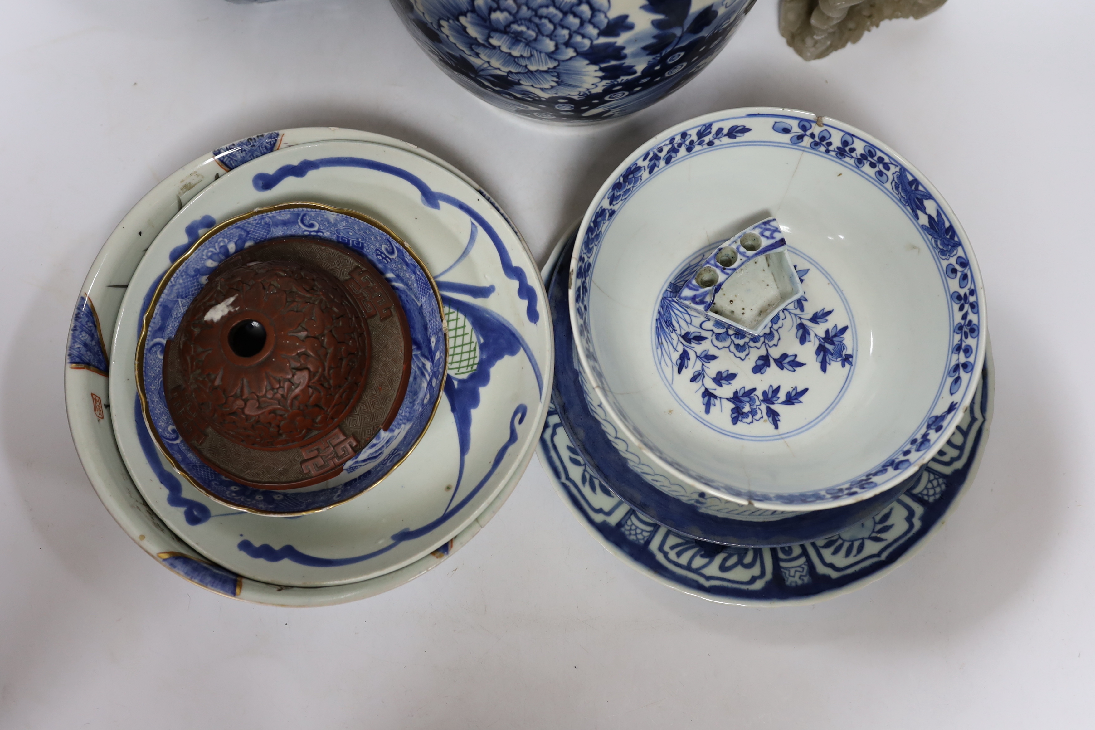 A Chinese blue and white jar and a soapstone figure, 31cm high